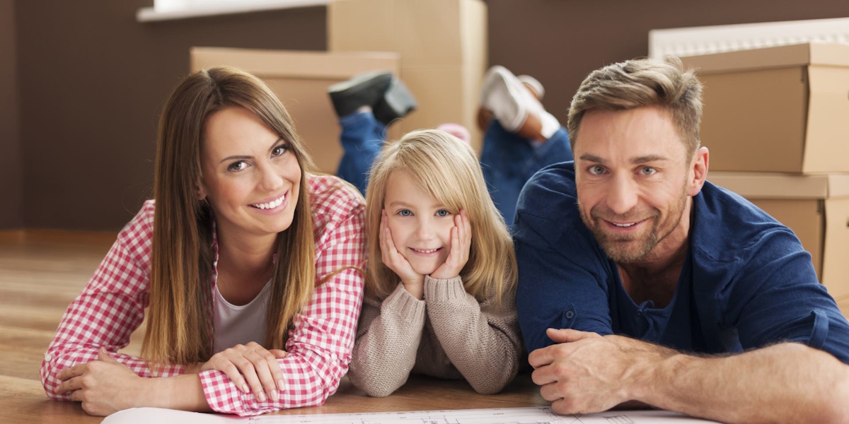 Family in front of house